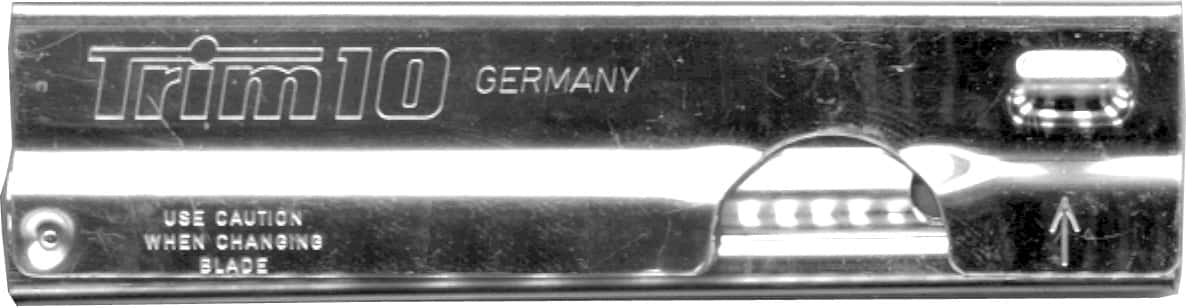 Trim Halfter 10cm von Unger Deutschland Trimmhalter 10 cm mit Vorsichtshinweisen und Klingenwechselanzeige.